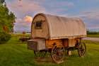 USA, Montana, Allentown. Evening light on covered wagon with evening sunset colors Art Print